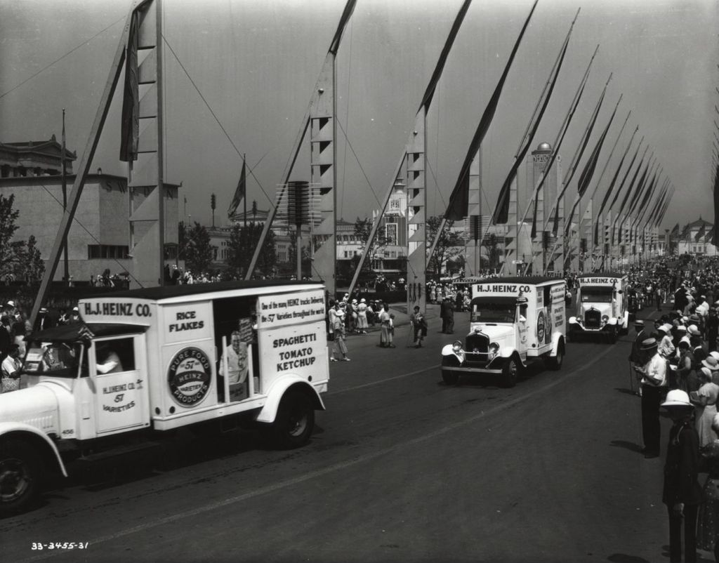Miniature of Heinz ketchup trucks parading down the Avenue of Flags at A Century of Progress International Exhibition.