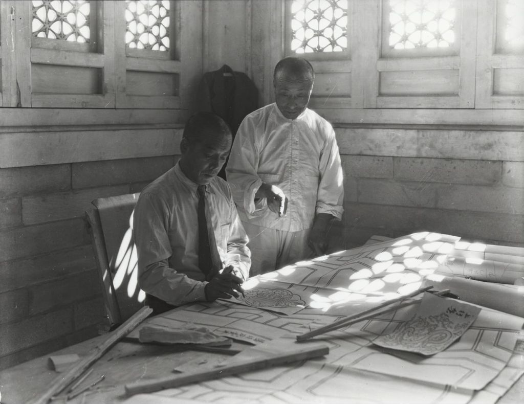 Miniature of Designers working on architectural sketches inside the Lama Temple.