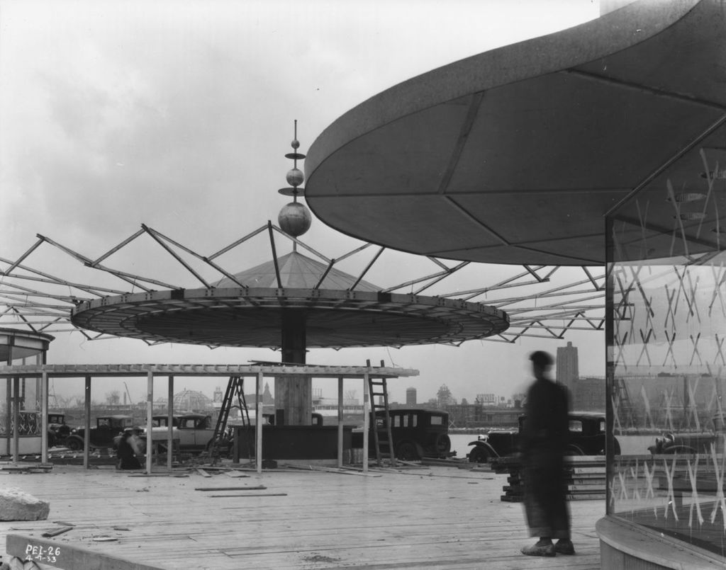 Construction of a giant umbrella at the Enchanted Island exhibit