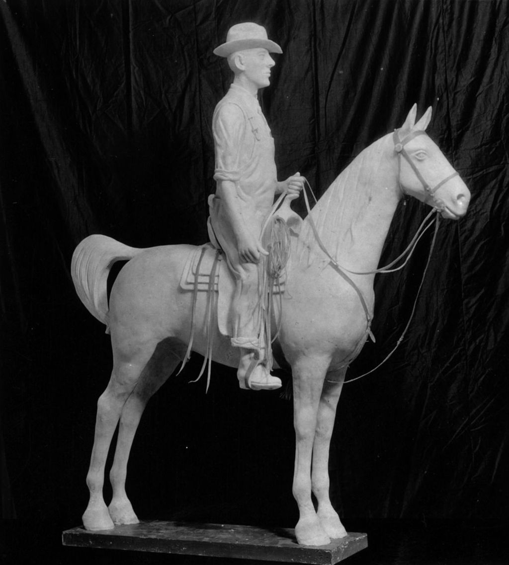 Miniature of This miniature statuette depicting a man in overalls on a horse titled Stockman's Pride by artist Wilbur Freece is made of butter.