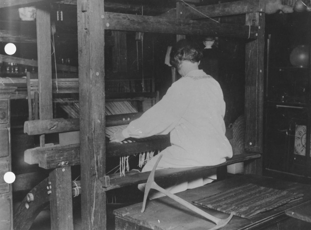 Miniature of Woman operating a weaving machine