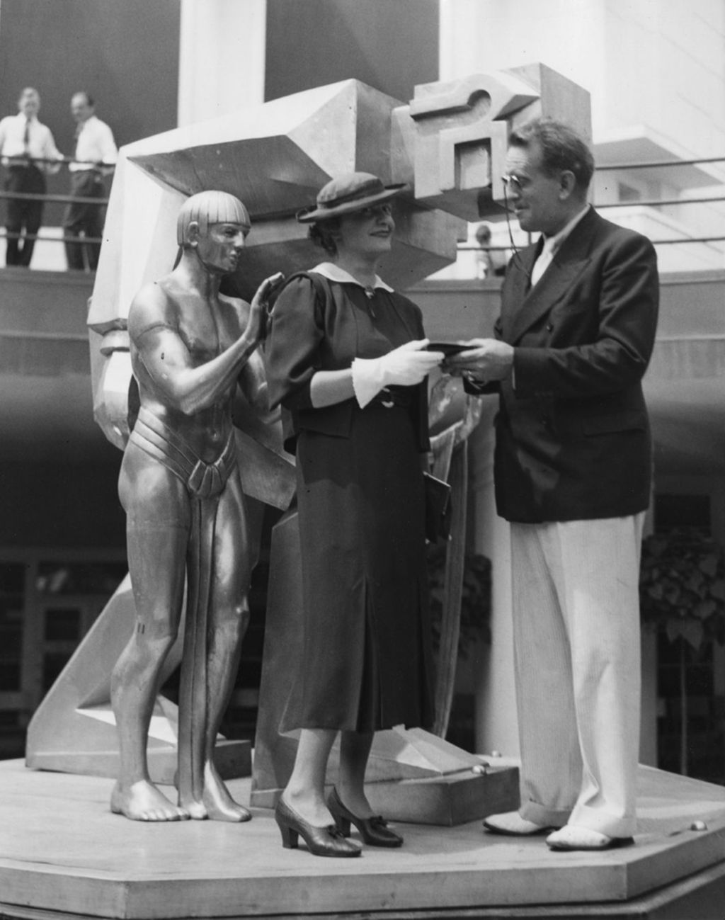 Louise Lentz Woodruff standing next to the sculpture she designed for the Fountain of Science, located in front of the main entrance to the Hall of Science.