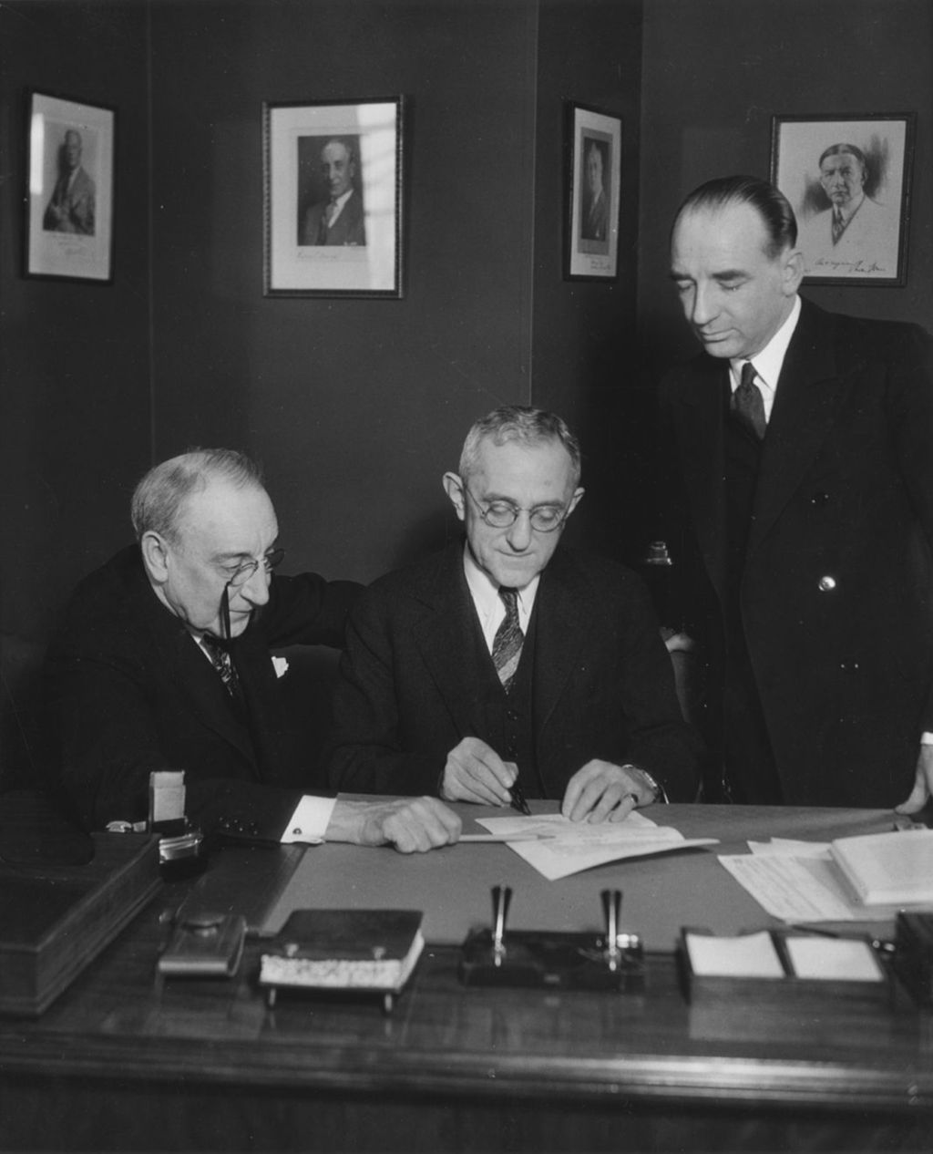 Edward H. Sniffen, Asst. Vice-President of Westinghouse Electric and Manufacturing Company, signing contract for renewal of the company's exhibit