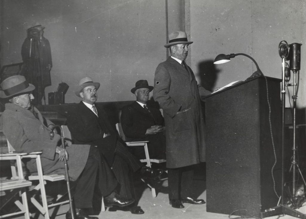 Miniature of Unknown man speaking at a press conference.