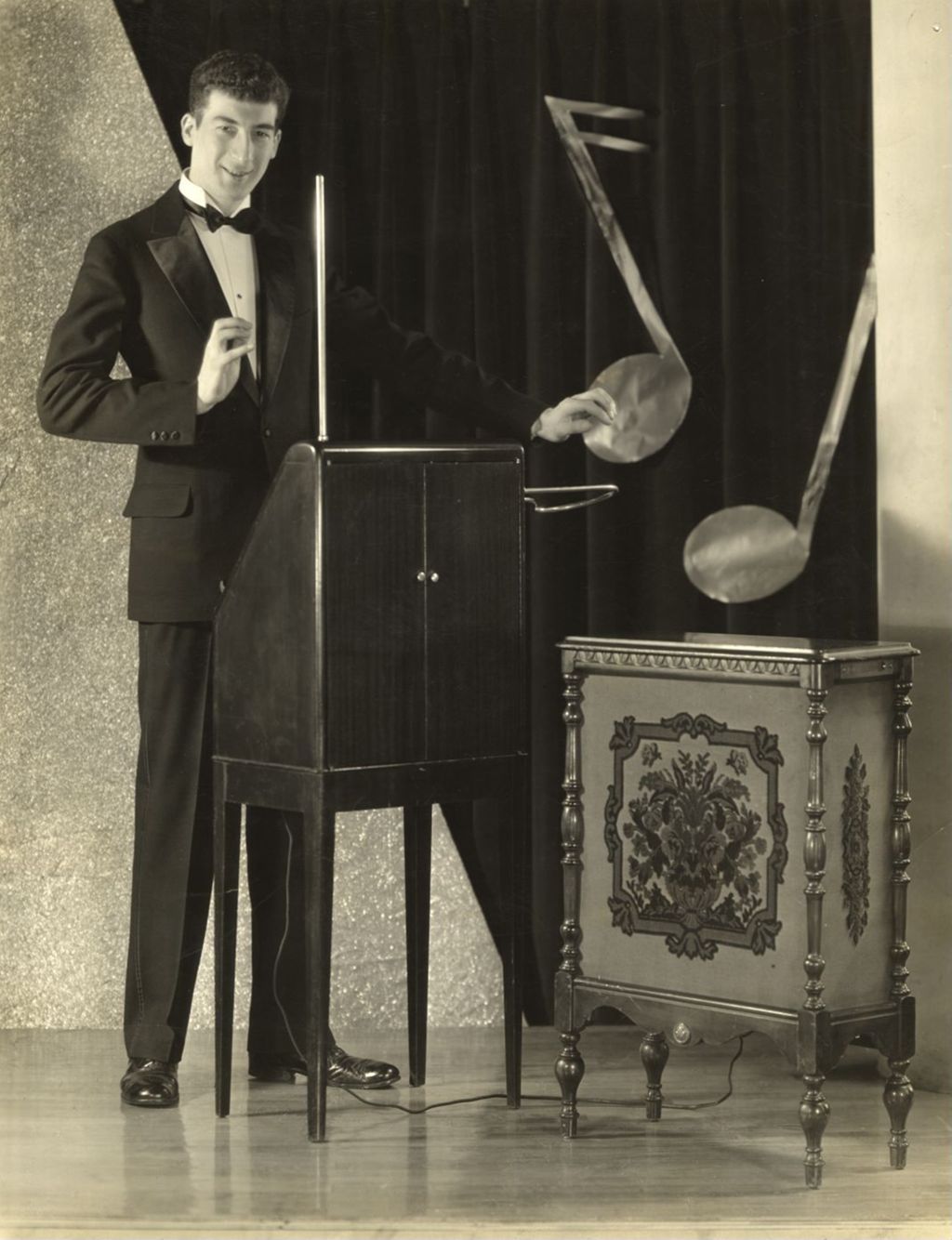 Miniature of Charles Stein demonstrates the use of a theremin musical instrument