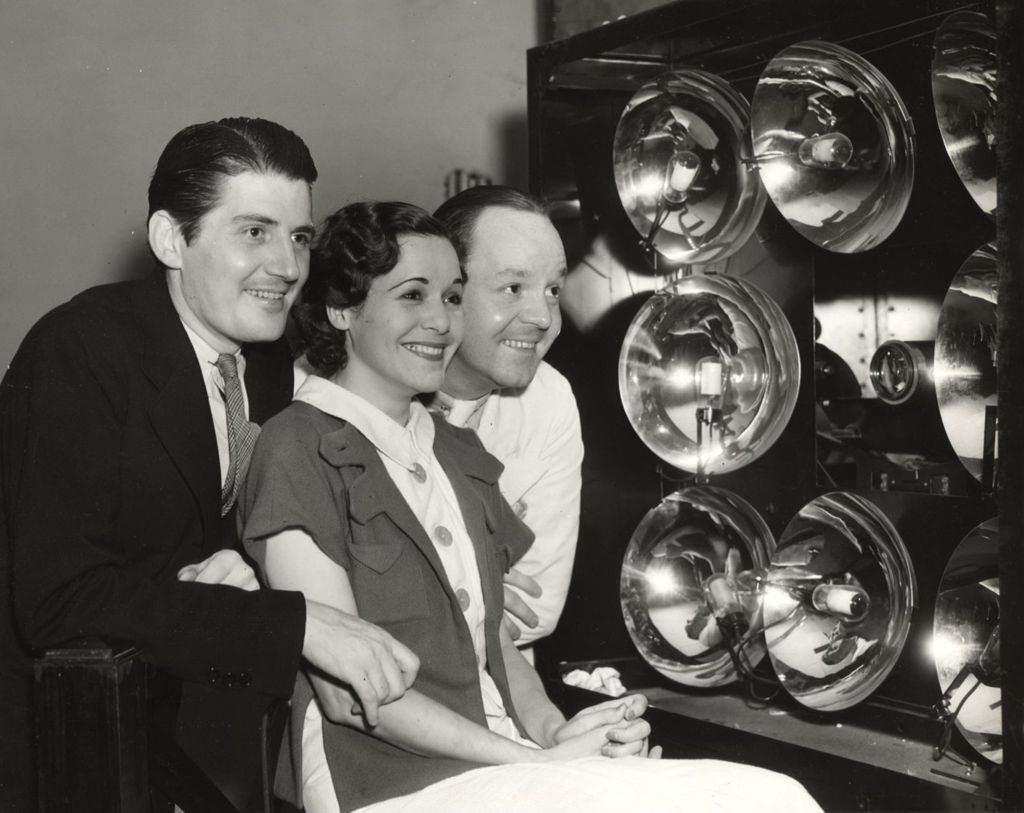 Employees of the Milky Way Company at the Court theater inspecting the television apparatus at the television exhibition