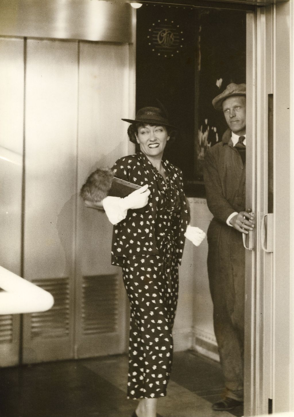 Gloria Swanson steps from the elevator of the west Skyride tower