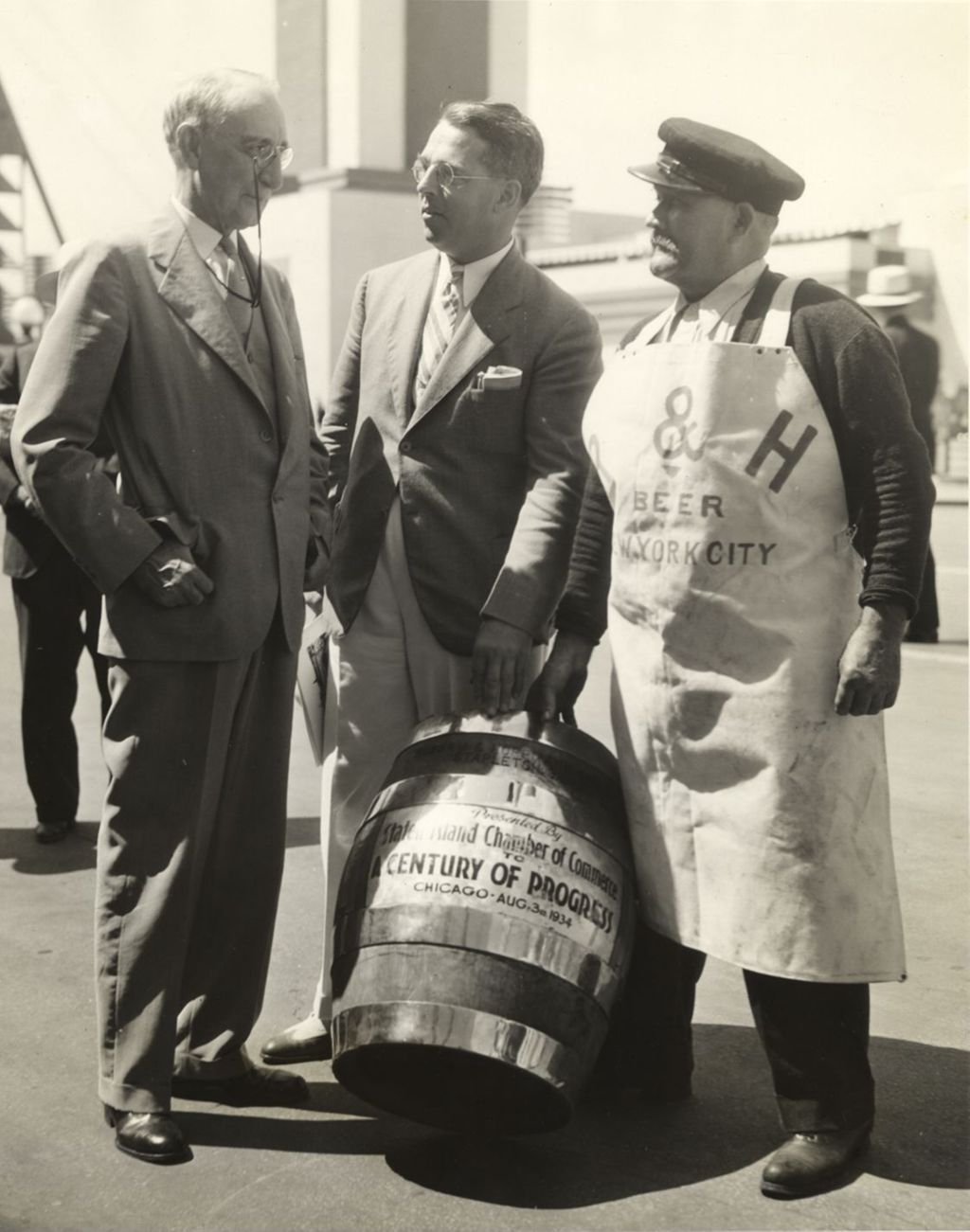 L.W. Kaufman, president of the Staten Island Chamber of Commerce making the presentation of specially brewed beer to President Dawes