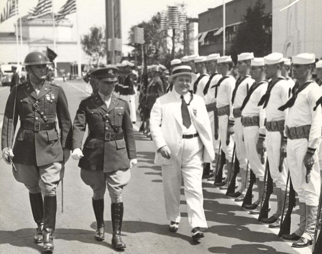 Governor Dave Sholtz inspecting the combined troops of the Army, Navy, and Marine Corps detachments stationed at the fair