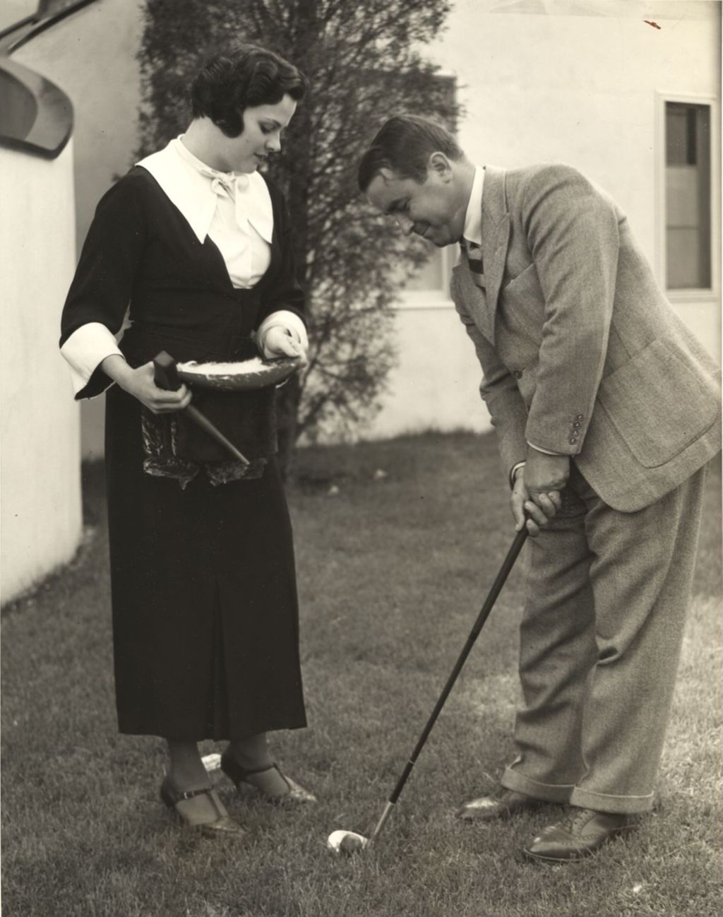 Gene Sarazen wielding a niblick against old fashioned 'feather' golf balls