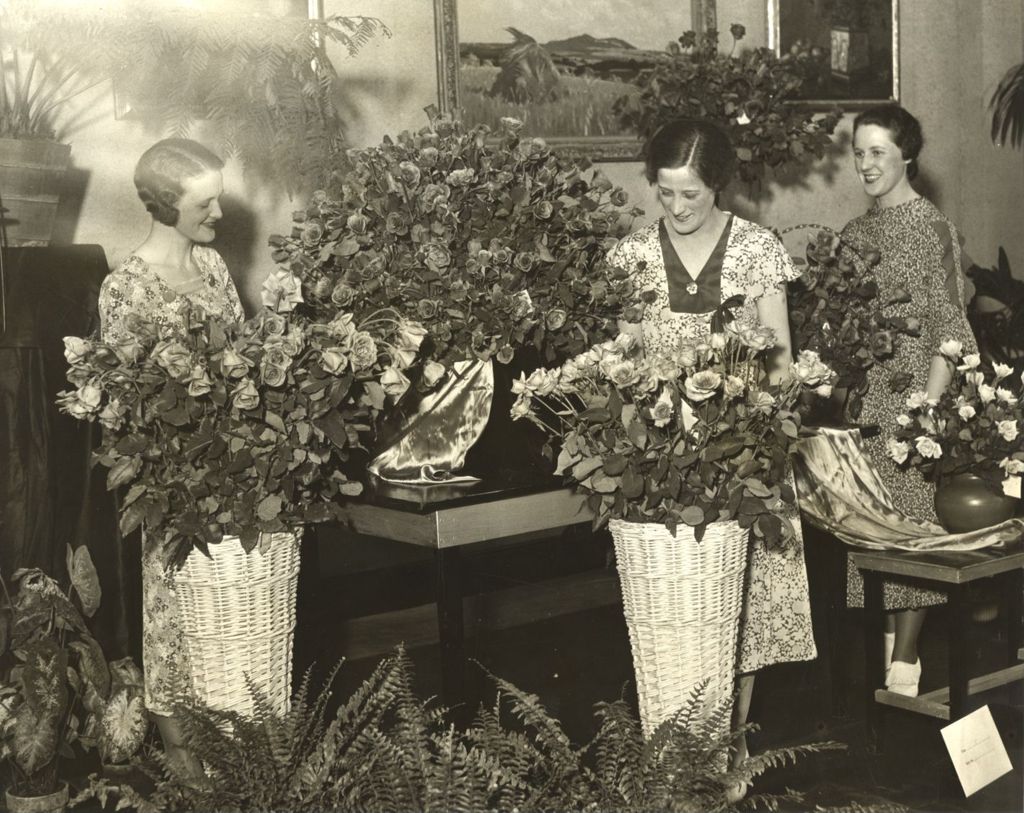 Women inspect rose exhibit in the Horticulture Building