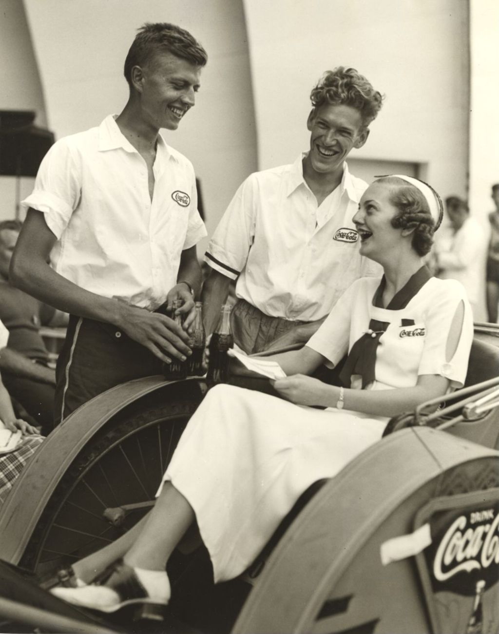 Miniature of Members of the Coca-Cola team celebrate after winning the Century of Progress rickshaw race. They are, from left to right: Bob Milow, George Nelson, and Jane Fite.