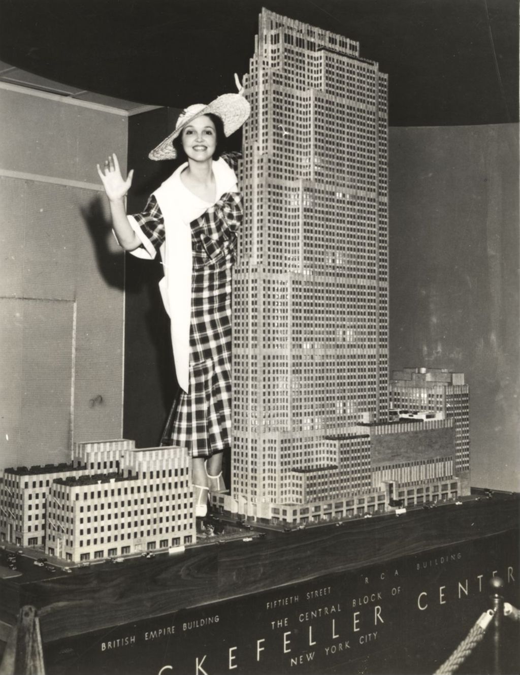 NBC radio star waves from the model of the RCA building in Rockefeller Center