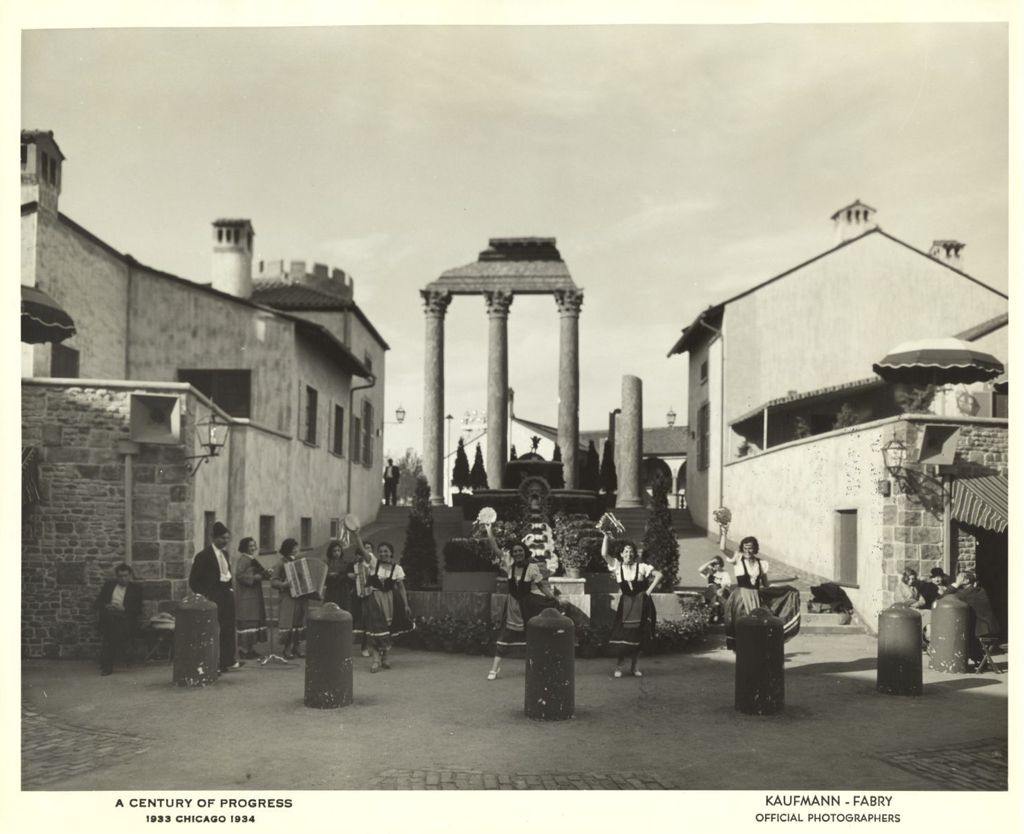 The Monforte Sisters (the four women playing the instruments standing towards the rear left) perform at the Century of Progress Italian Village.