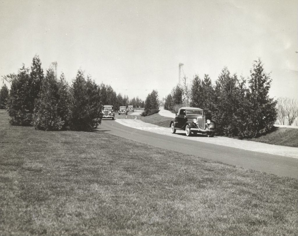 Cars driving around track at the Century of Progress International Exposition, 1933-1934