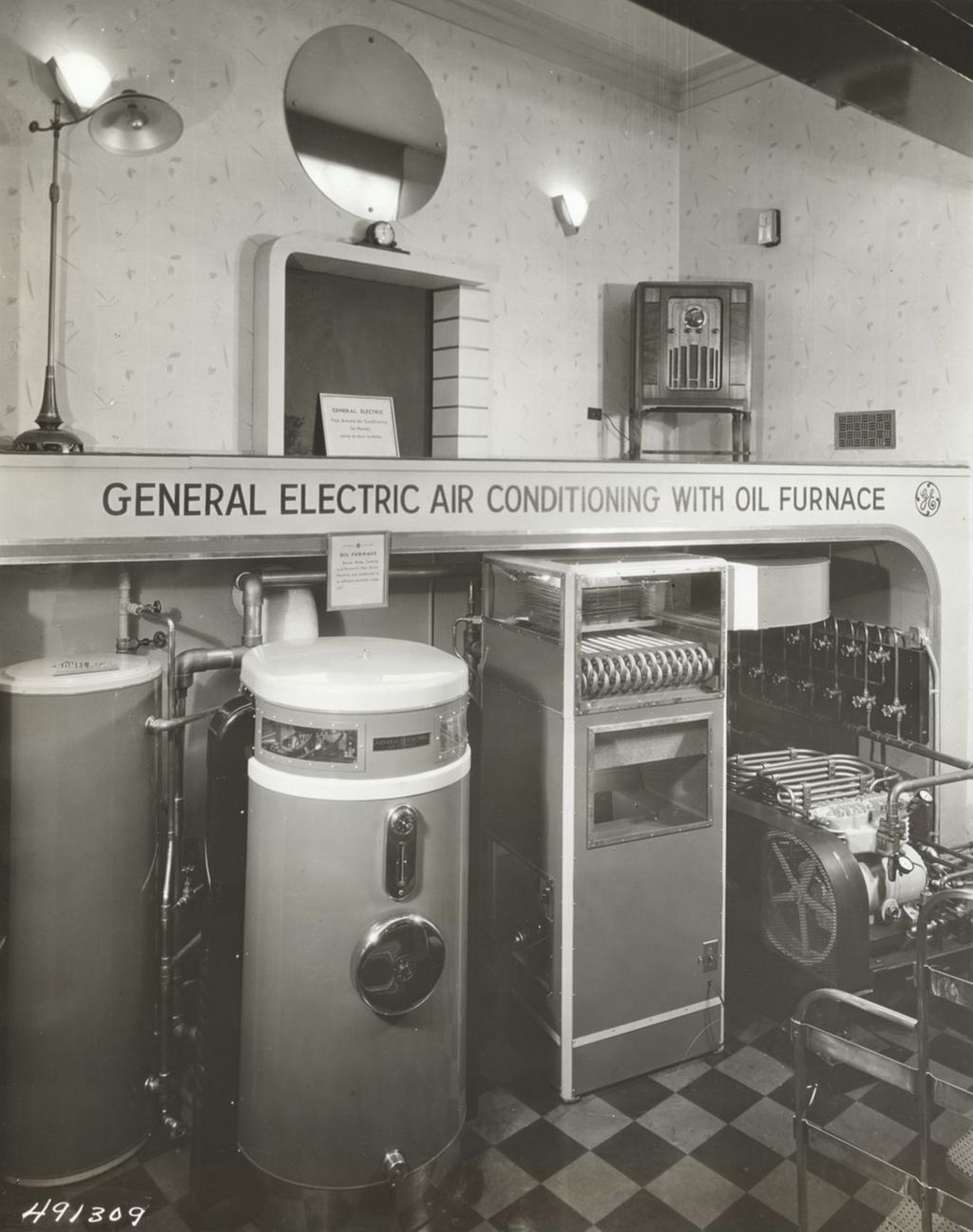 Miniature of A complete air conditioning system for a home of moderate size is shown in this sectional setting in the General Electric exhibit