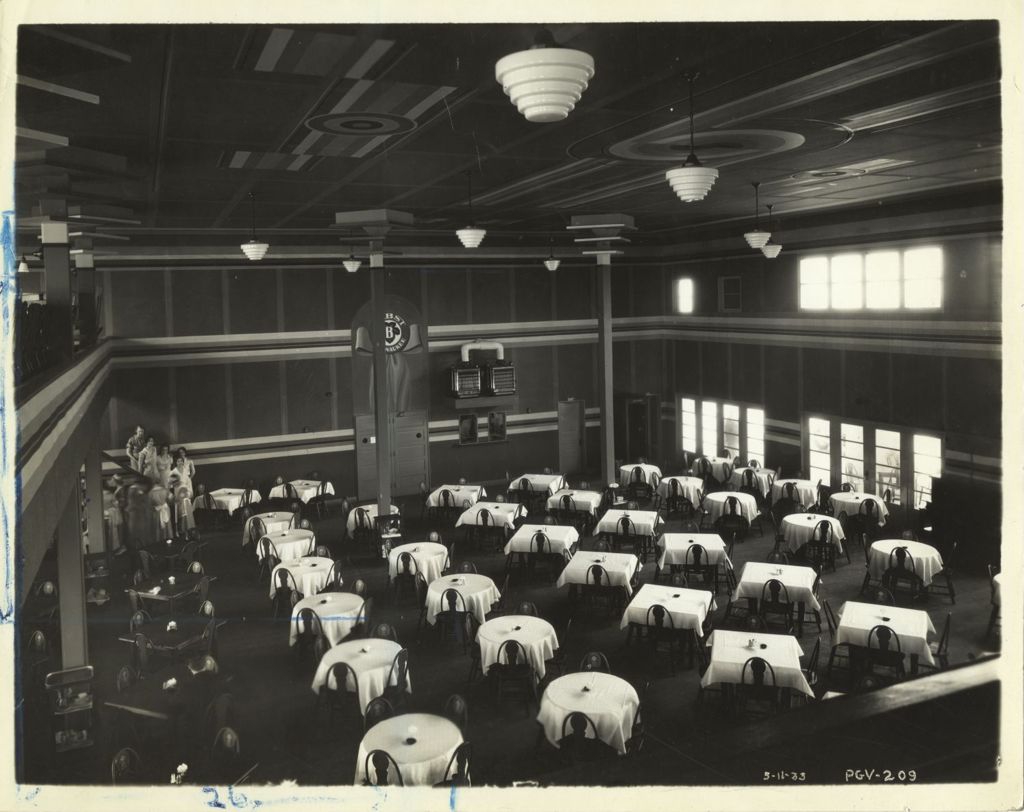Restaurant workers prepare tables at the Swift exhibit during the Century of Progress International Exposition.