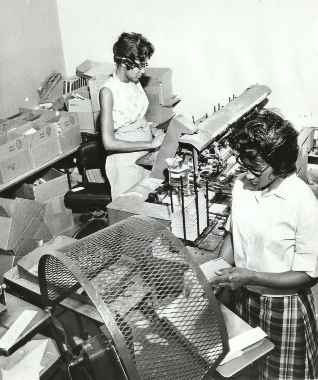 Miniature of Lillie Crouther and Shirley Johnson operating office equipment