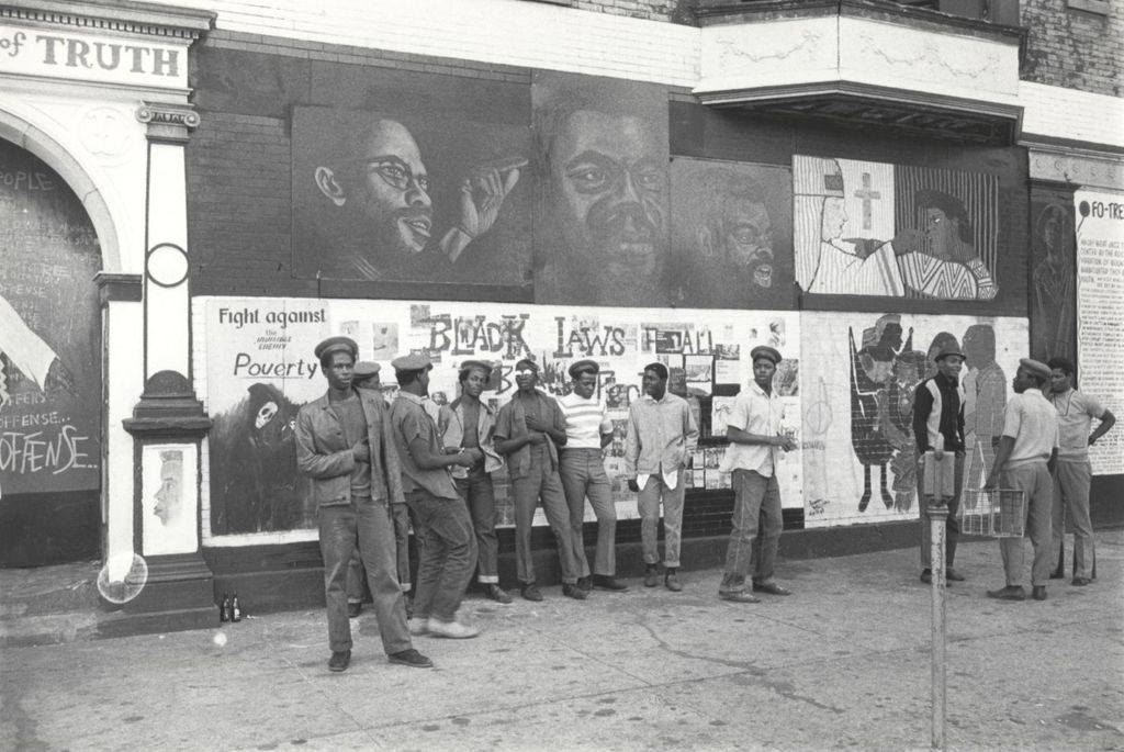 Men in front of Wall of Truth mural