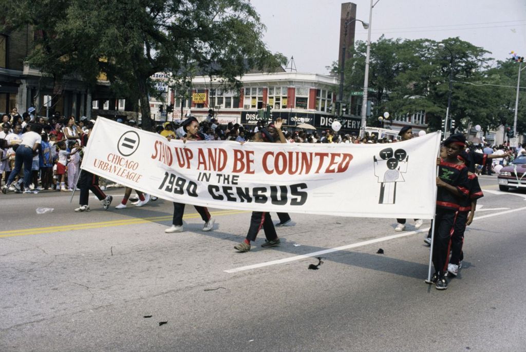 Parade marchers with Census banner