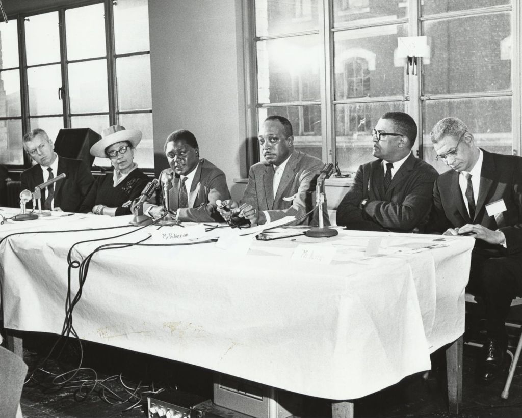 Bill Berry at a conference table with others