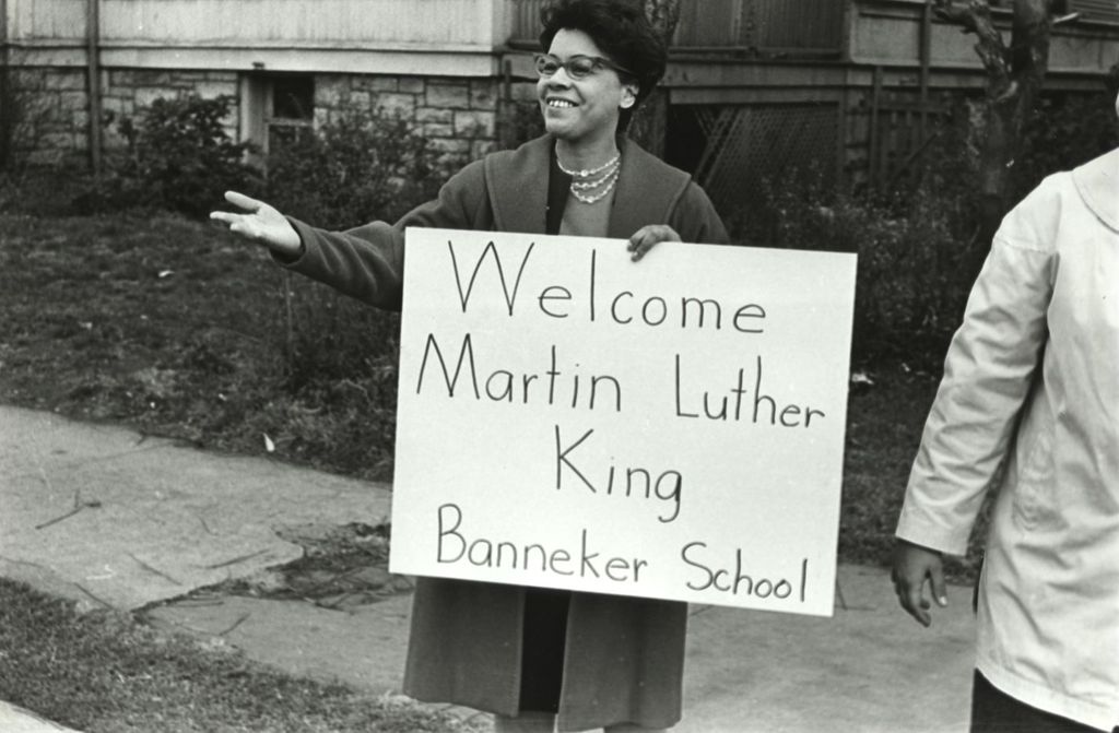 Miniature of Woman holding sign welcoming Martin Luther King, Jr.