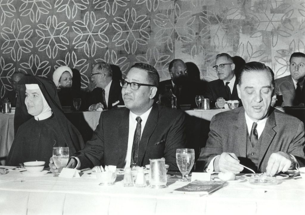 Miniature of Mary Peter Clover, Robert Thomas, and Mel Hosch at a dining event