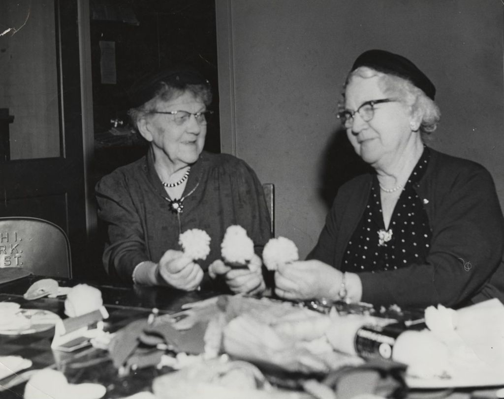 Miniature of Two women at the South Deering senior center holding crafting flowers