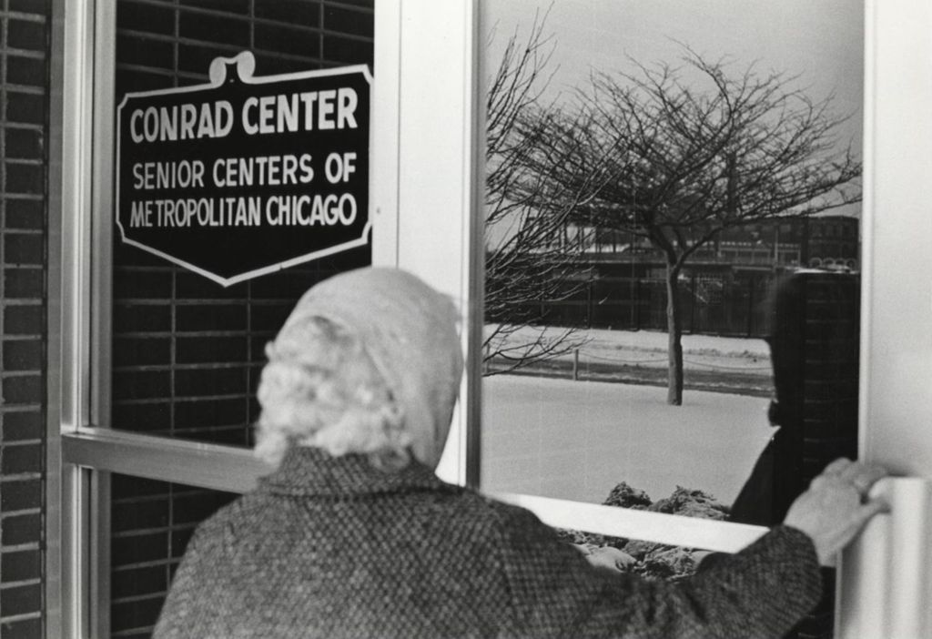 A woman enters the Conrad Center, one of the Senior Centers of Metropolitan Chicago