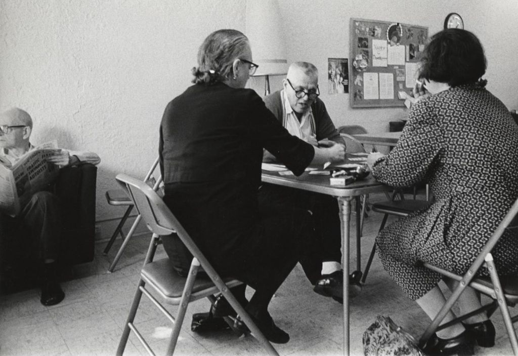 Seniors playing cards at a senior center affiliated with Hull-House