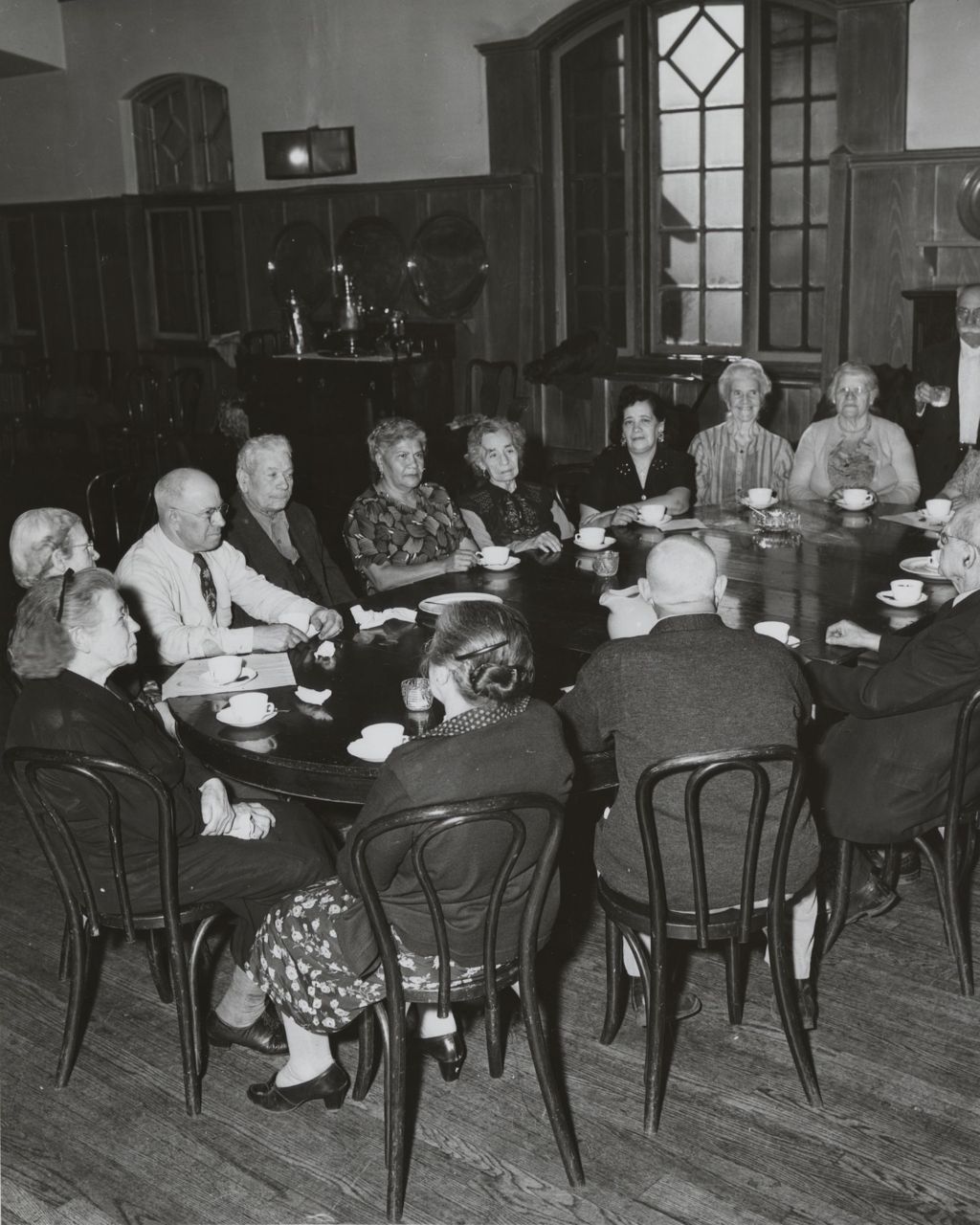 Miniature of Members of the Hull-House senior citizens club "Young Old Timers" having coffee or tea around a table in the Residents Dining Hall