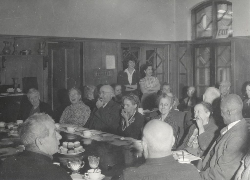 Miniature of Members of the Hull-House senior citizens club having coffee and cupcakes in the Residents Dining Hall