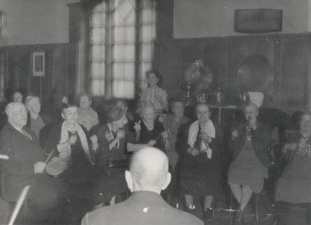 Members of the Hull-House senior citizens club playing musical instruments in the Residents Dining Hall