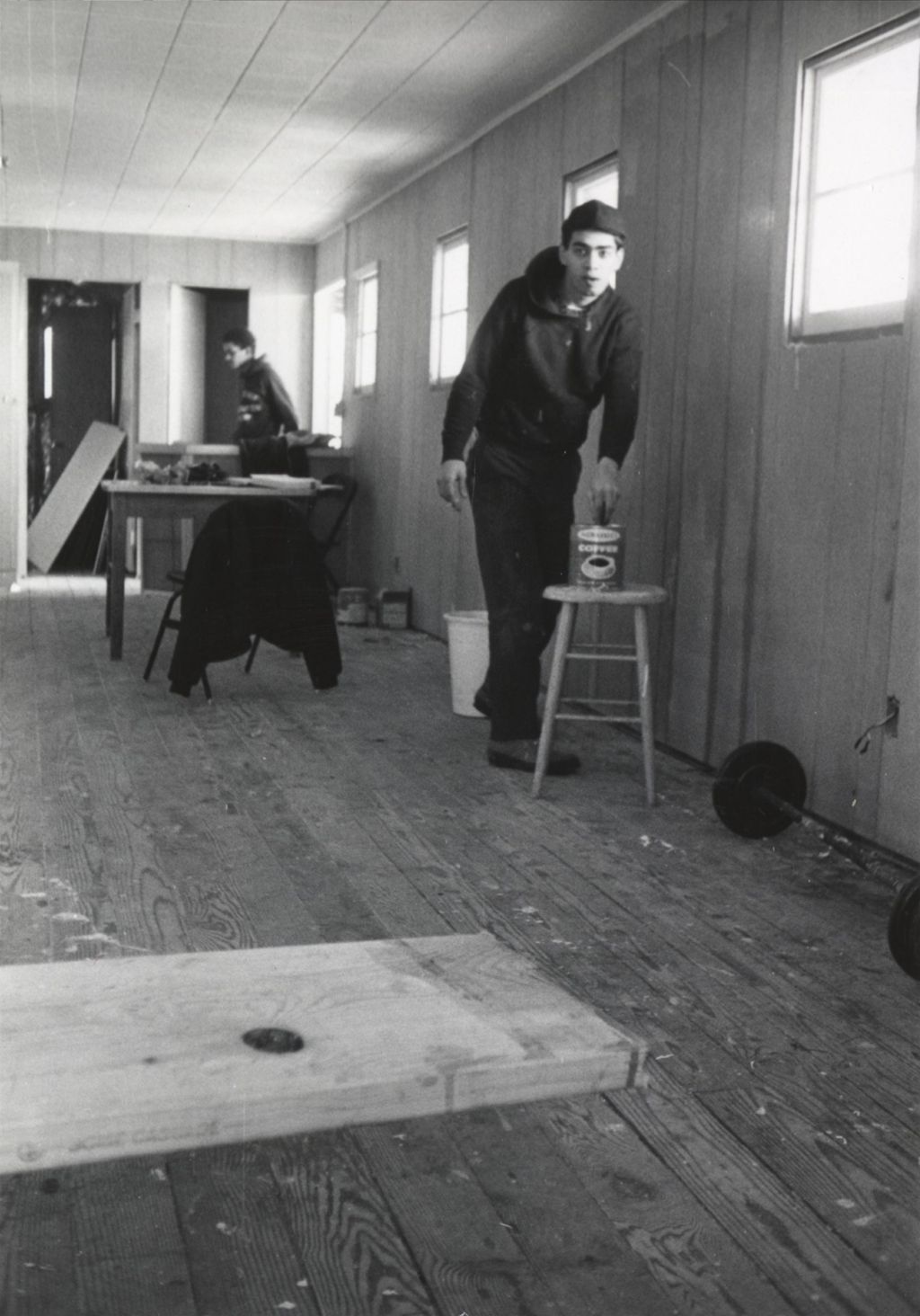Two young men working in a room at the Hull-House camp in Wisconsin
