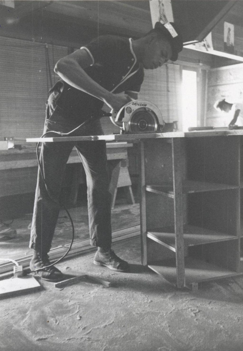 Miniature of Young man sawing lumber at the Hull-House camp in Wisconsin