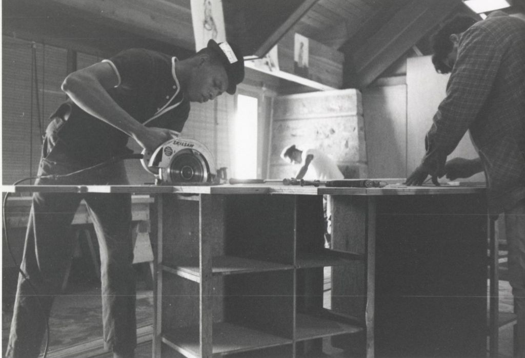 Miniature of Young man sawing lumber at the Hull-House camp in Wisconsin
