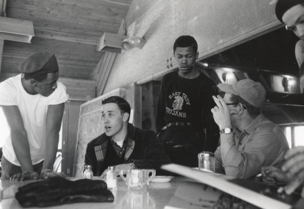 Men and young men talking at the Hull-House camp in Wisconsin