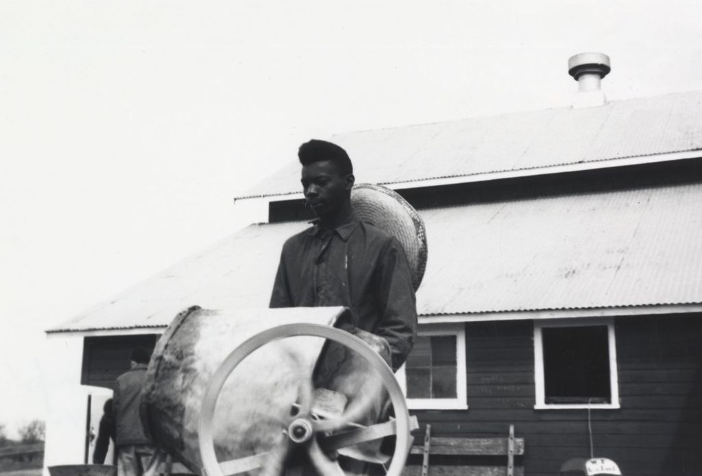 Miniature of Young man next to a cement mixer at the Hull-House camp in Wisconsin