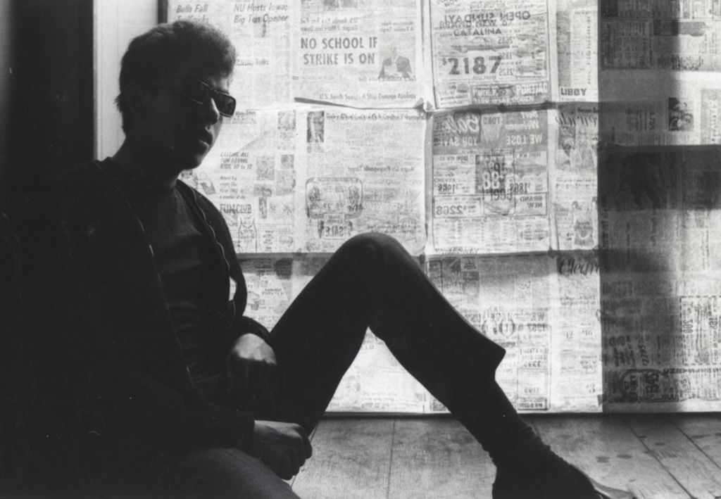 Miniature of Young man in sunglasses sitting on the floor in a building at the Hull-House camp in Wisconsin