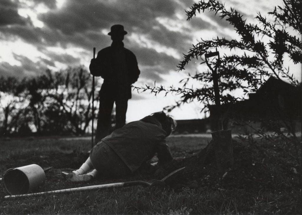 Two people digging a hole at the Hull-House work camp in Wisconsin