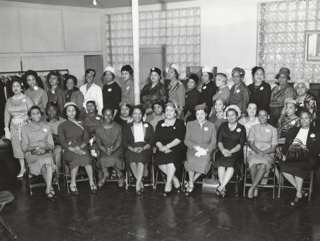 Women involved with sewing and millinery (hatmaking) posing at Parkway Community House