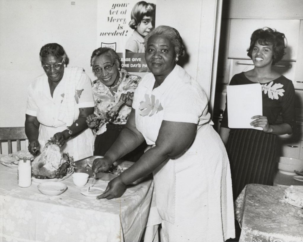 Miniature of Three senior women preparing Thanksgiving dinner event for seniors at Parkway Community House as Miss Wiley looks on