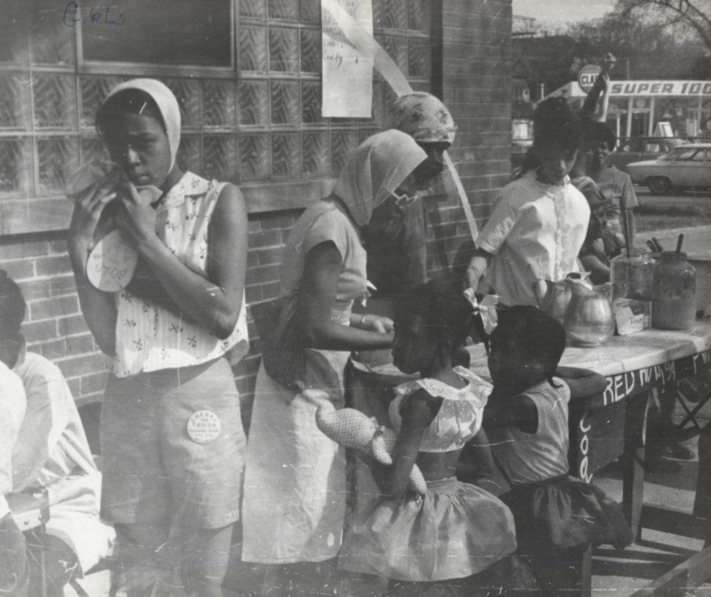 Miniature of Young women at a vending table during Carnival Day, part of Parkway Community House's 1961 "Clean Up Week"