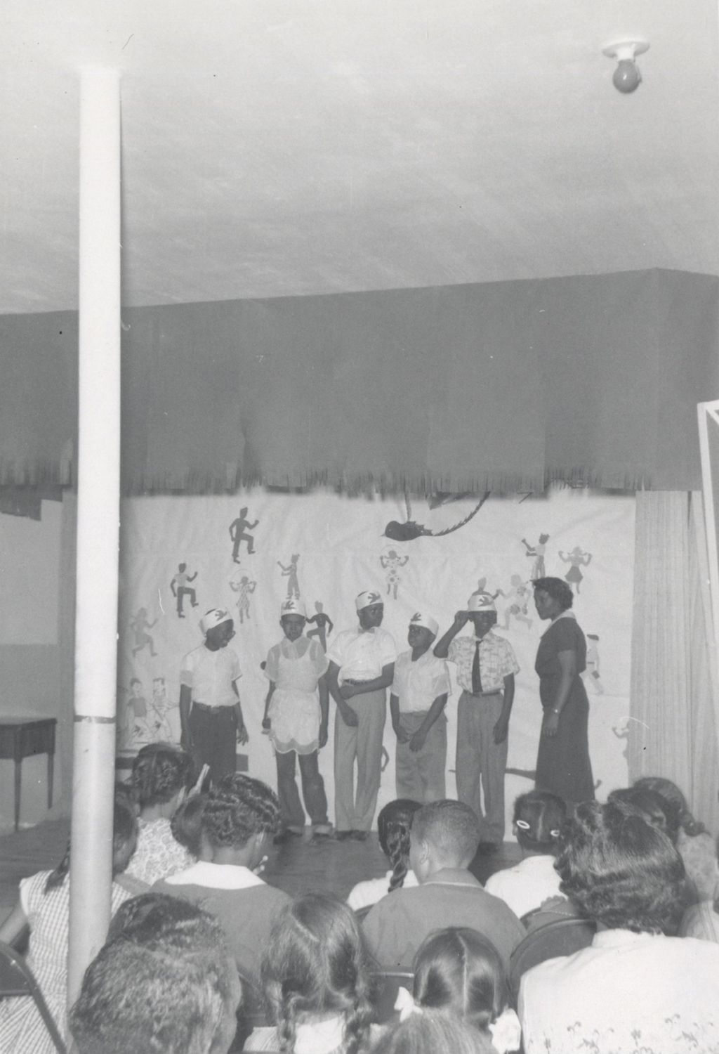 Five young men on stage at an event at Parkway Community House