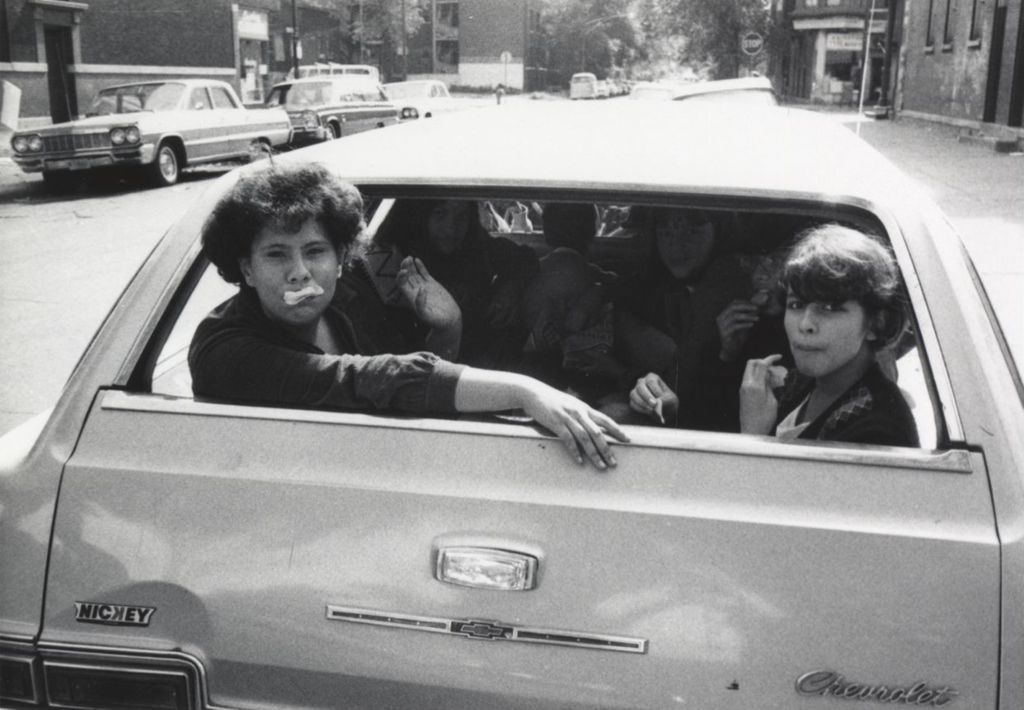 Miniature of Several young women in the back of a Chevrolet station wagon, likely near the Hull-House Jane Addams Center on their way to a "spring activity"