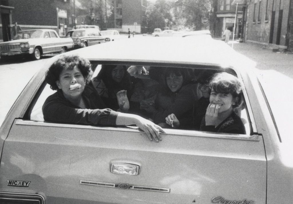 Miniature of Several young women in the back of a Chevrolet station wagon, likely near the Hull-House Jane Addams Center, during a "spring activity"