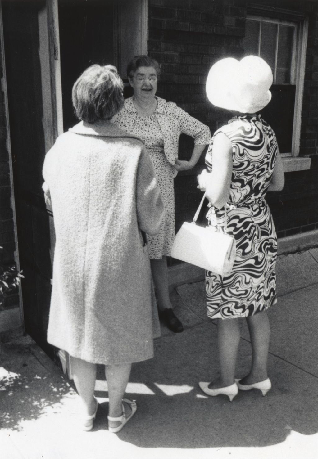 Miniature of Three women outside a brick building