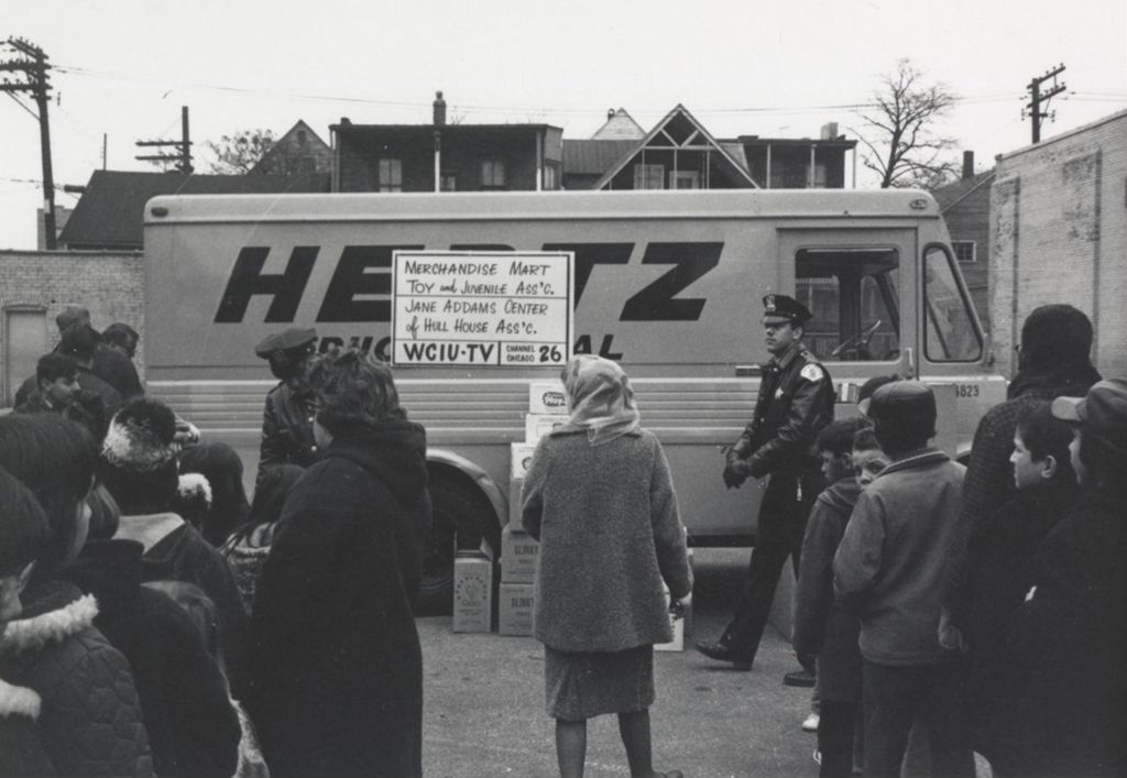 Children in line at a Hull-House Christmas toy giveaway