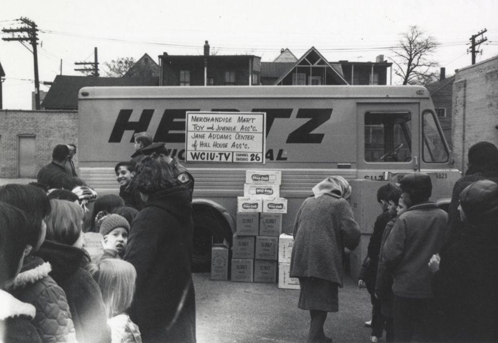 Children in line at a Hull-House Christmas toy giveaway