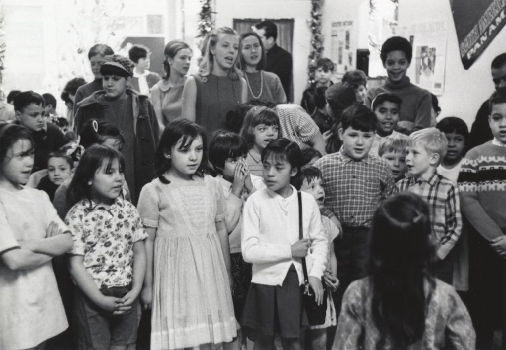 Children and adults at a Hull-House Christmas party at Jane Addams Center